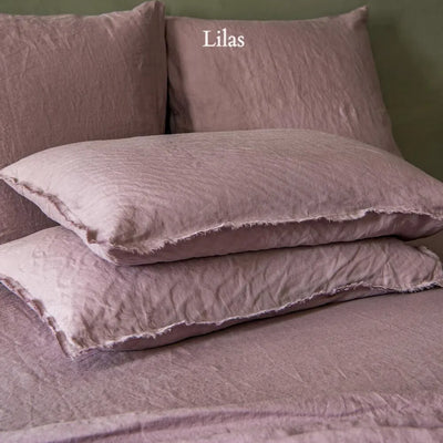 Taies d'oreiller à bords effrangés en lin lavé Lilas #colour_lilas